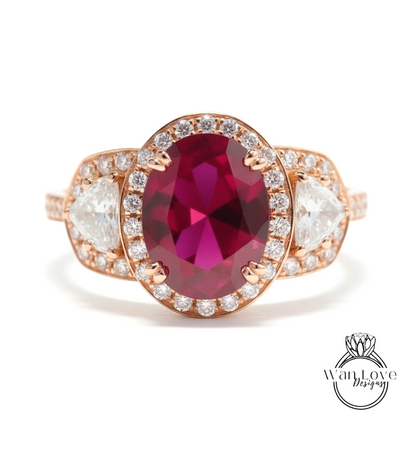 A close-up of a beautiful pink gemstone ring with a large oval-shaped gemstone surrounded by smaller diamonds.