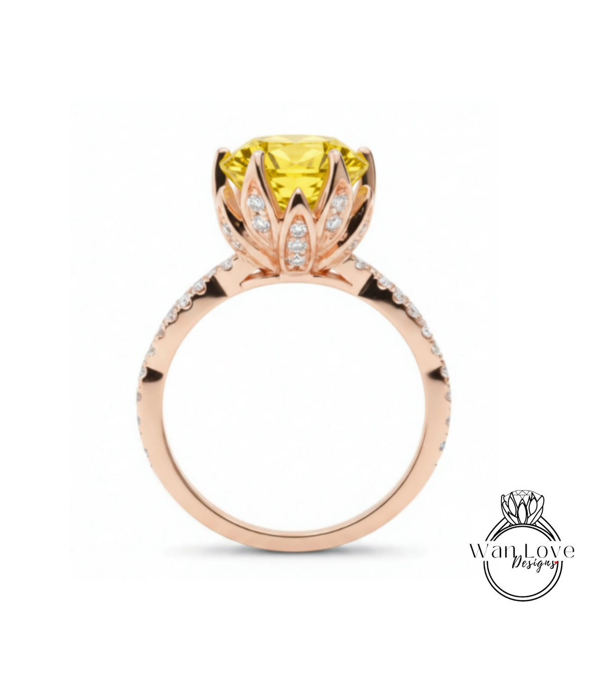 A gold ring with a large yellow gemstone, possibly a diamond, at the center, surrounded by smaller diamonds.