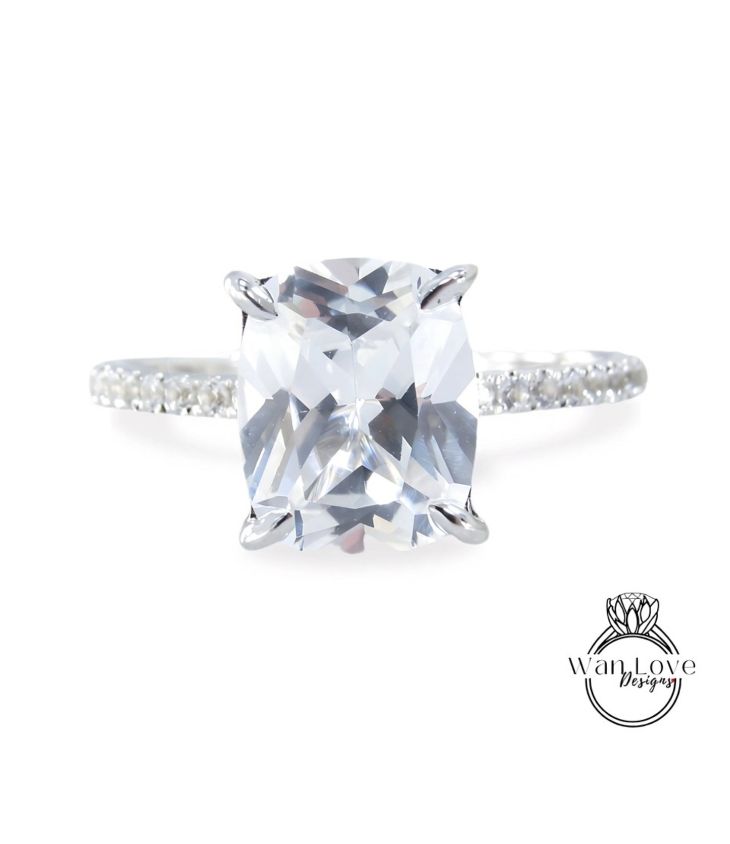 A close-up view of a diamond engagement ring with a large, clear gemstone set in a silver band.