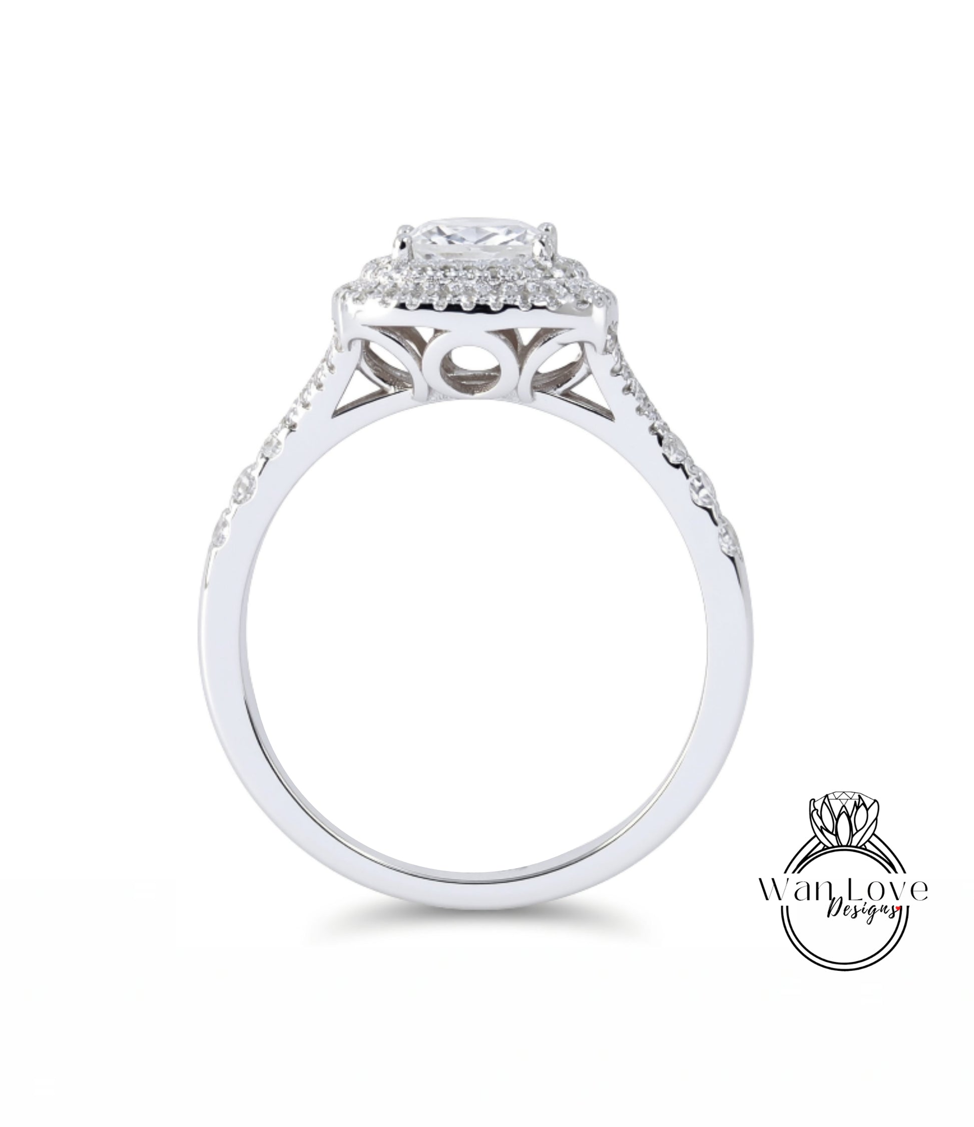 A silver engagement ring with a large central diamond surrounded by smaller diamonds, set in a halo of smaller diamonds.