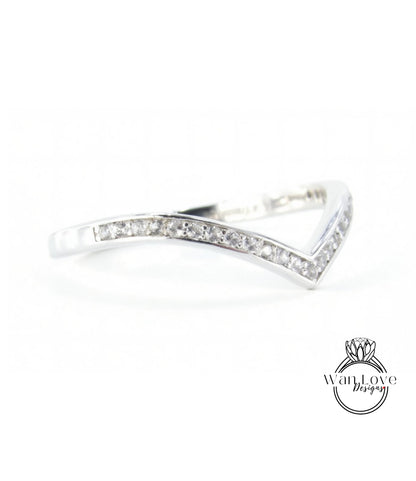 A silver ring with a diamond-encrusted band.