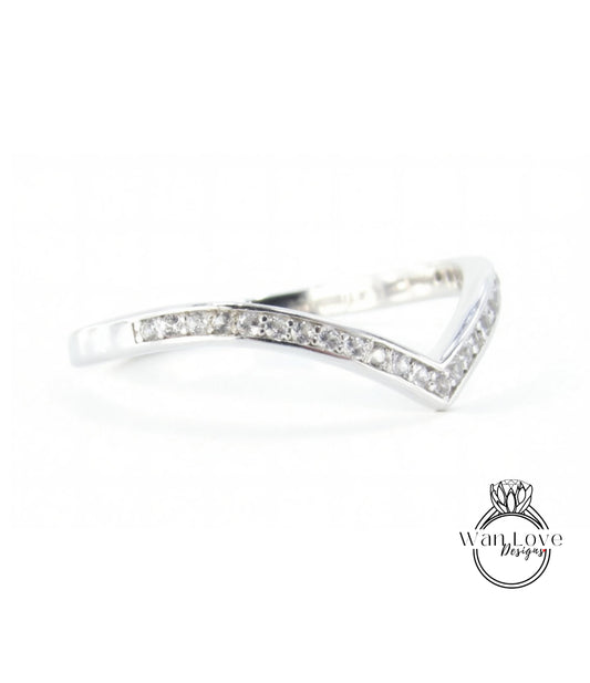 A silver ring with a diamond-encrusted band.