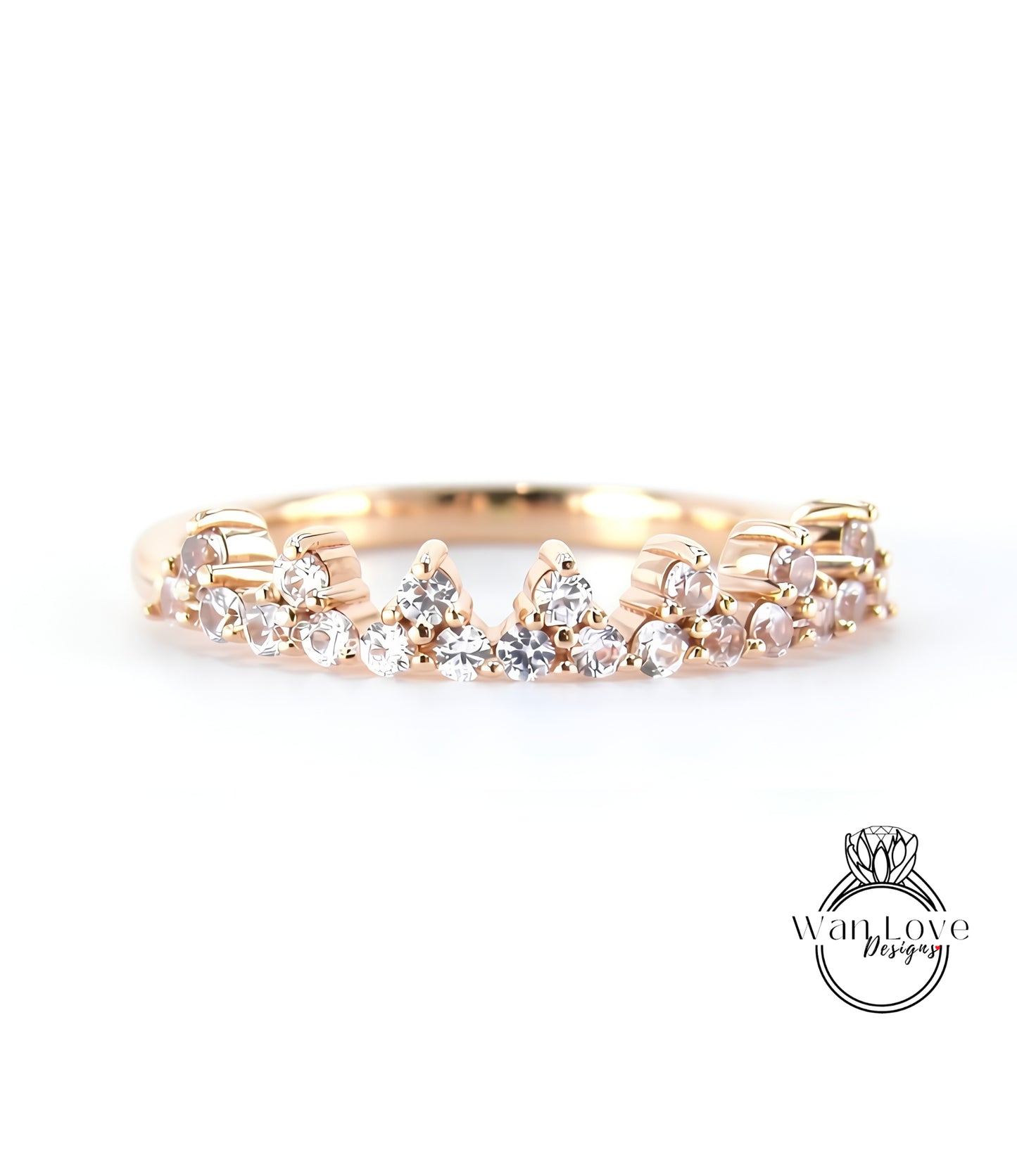 A gold ring with a decorative band featuring small diamonds.