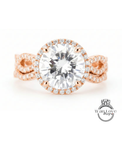 A close-up image of a beautiful engagement ring with a large, round diamond set in a halo of smaller diamonds, surrounded by a delicate, twisted band of gold.