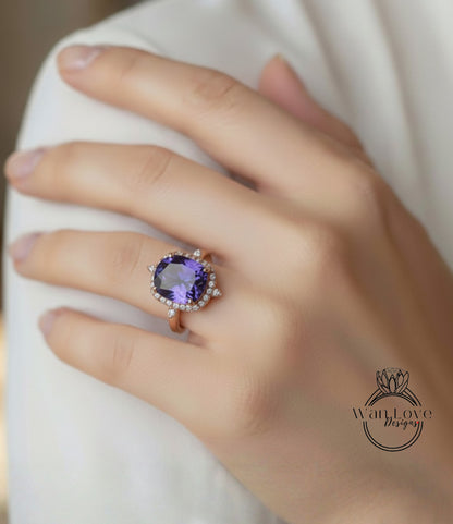 A close-up of a person's hand wearing a large, ornate ring with a purple gemstone.