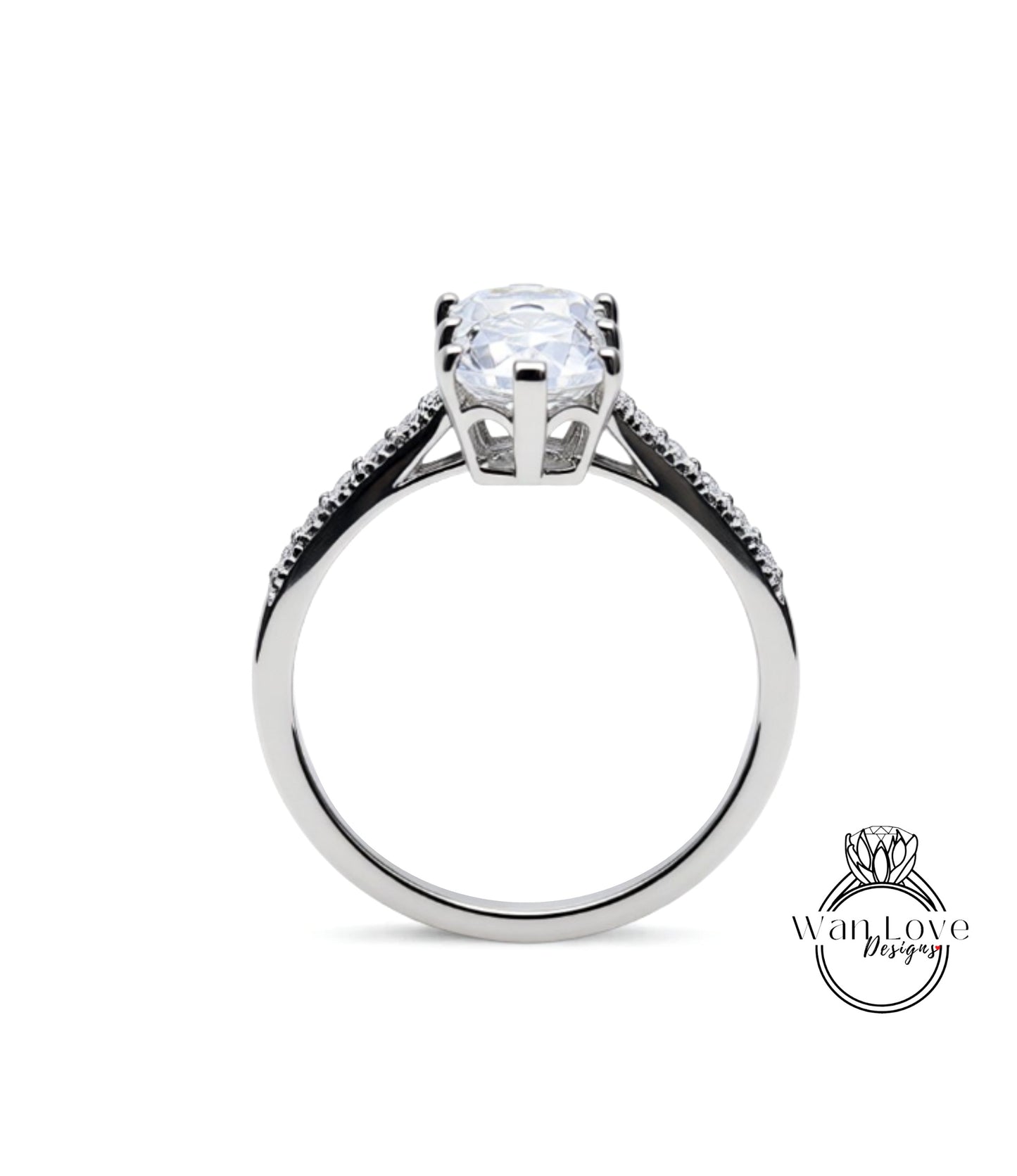 A silver engagement ring with a large central diamond and smaller diamonds on either side.