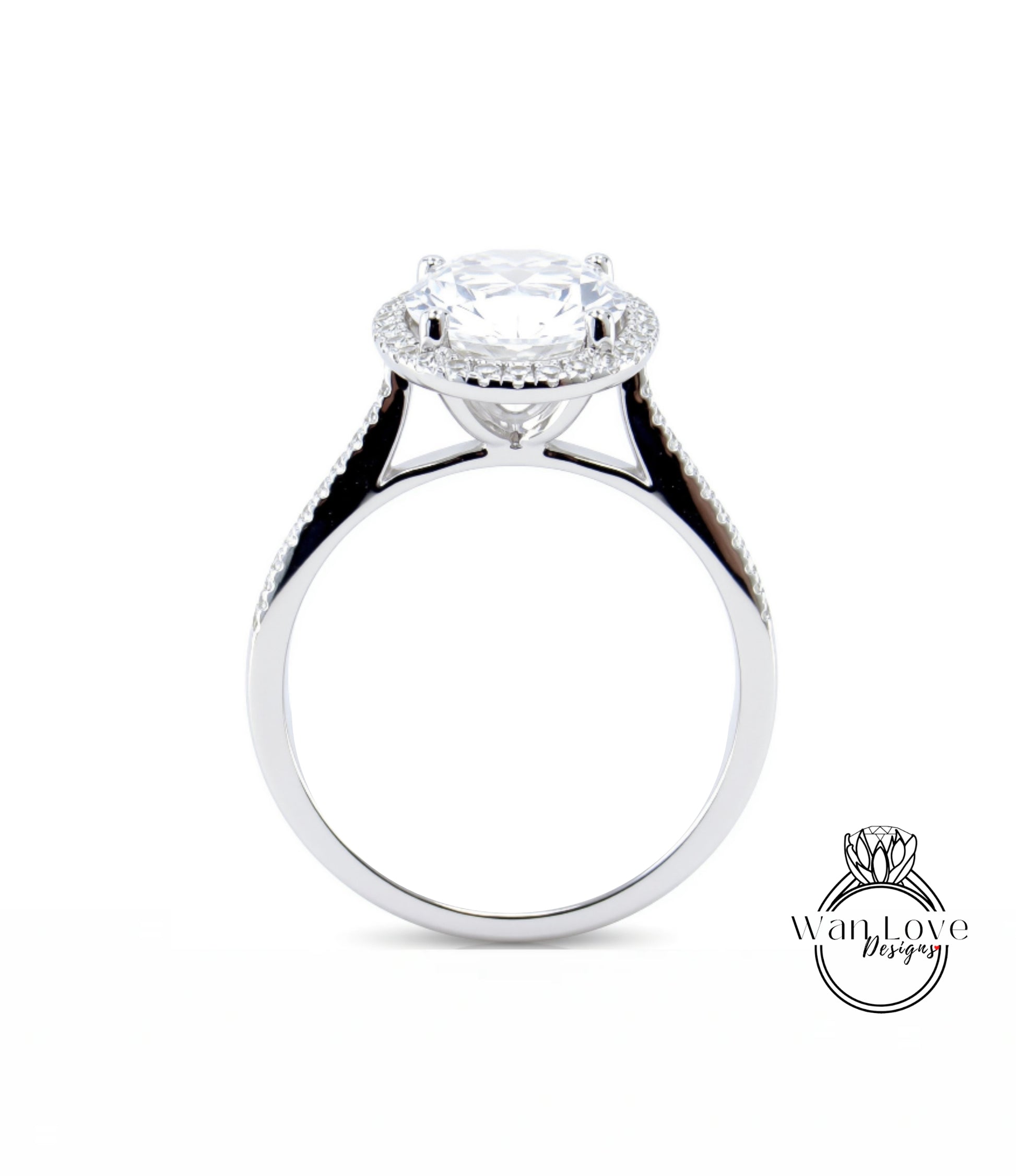 A close-up of a silver engagement ring with a large, round diamond at the center, surrounded by smaller diamonds.
