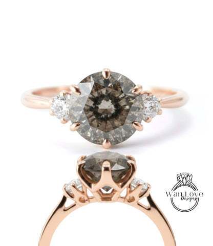 a beautiful engagement ring with a large oval-shaped diamond set in a rose gold band. The ring is adorned with three smaller diamonds on either side of the central diamond, creating a symmetrical and elegant design.