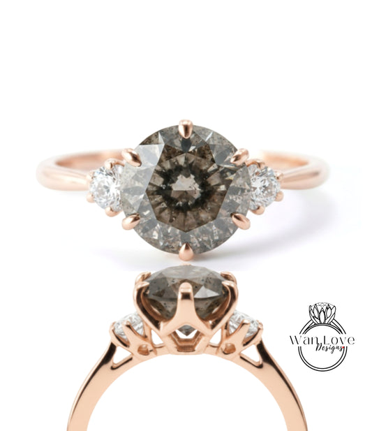 a beautiful engagement ring with a large oval-shaped diamond set in a rose gold band. The ring is adorned with three smaller diamonds on either side of the central diamond, creating a symmetrical and elegant design.