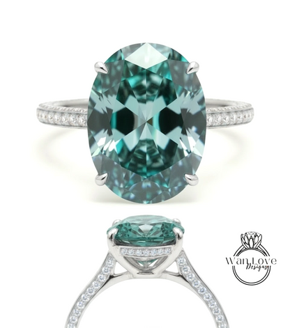 A large oval-shaped gemstone ring with a silver band and smaller diamonds around the band.