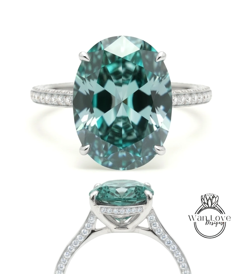 A large oval-shaped gemstone ring with a silver band and smaller diamonds around the band.