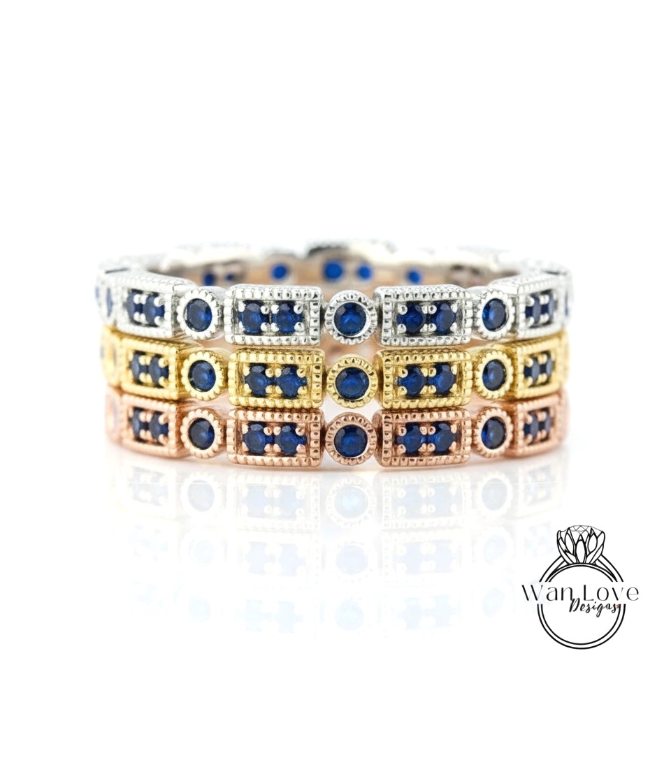 A close-up view of a silver ring with blue gemstones, showcasing the intricate design and craftsmanship of the jewelry piece.