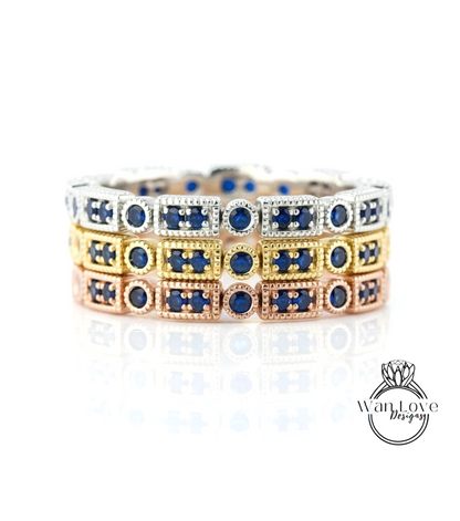A close-up view of a silver ring with blue gemstones, showcasing the intricate design and craftsmanship of the jewelry piece.