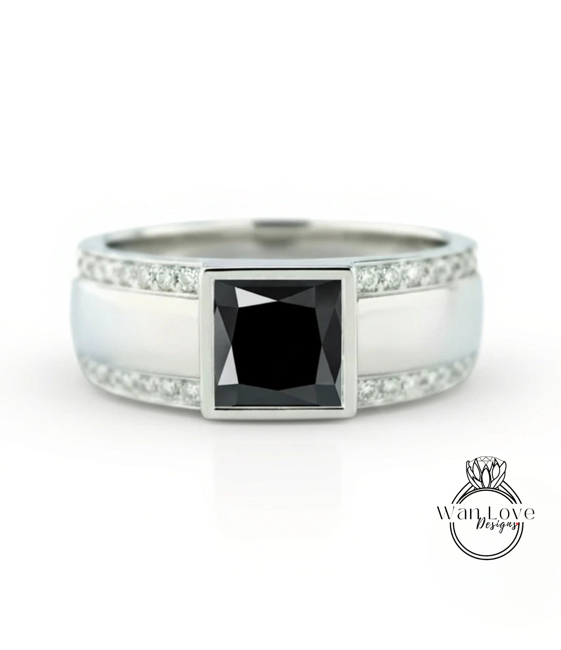 A silver ring with a large black diamond as the centerpiece, surrounded by smaller diamonds.