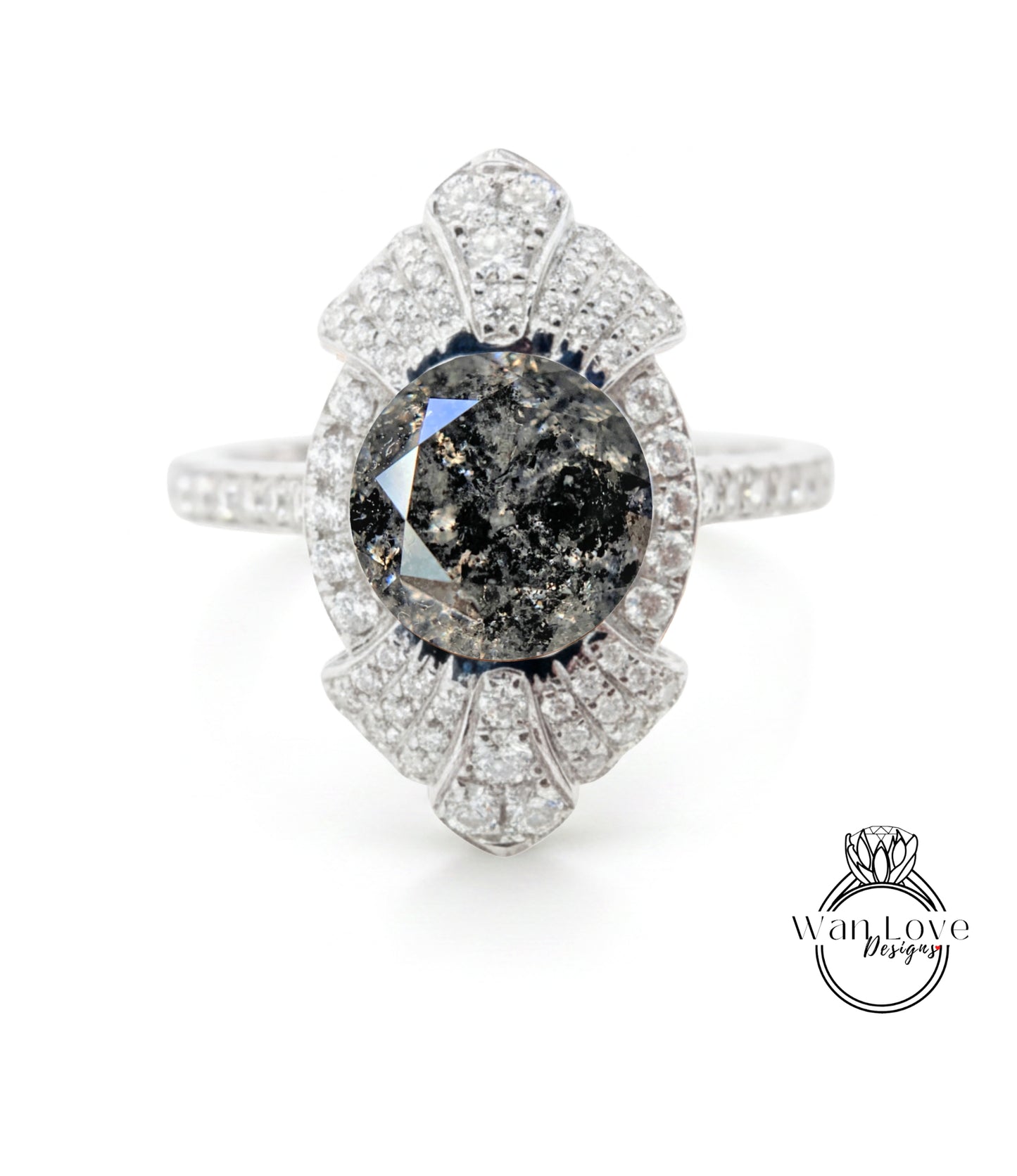 A diamond ring with a large central stone surrounded by smaller diamonds, set in a silver band.