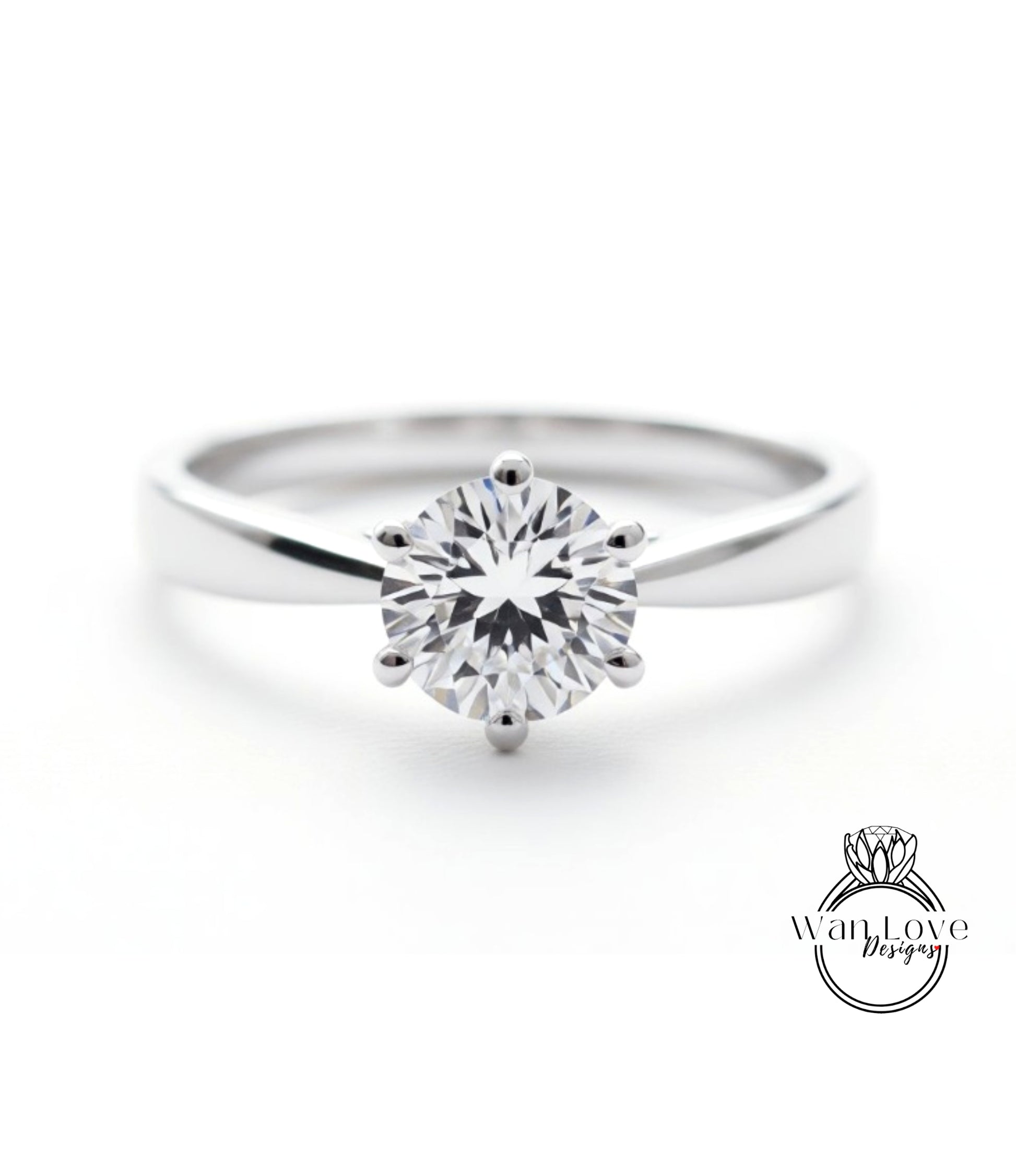 A close-up view of a diamond engagement ring with a large, brilliant-cut diamond set in a silver band.