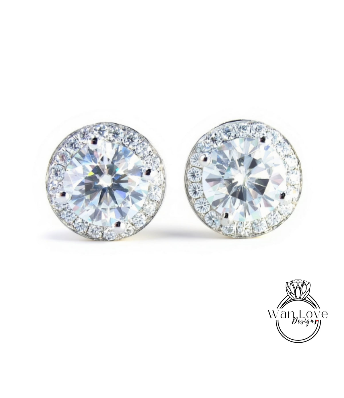 A pair of elegant earrings with large, clear gemstones set in a halo of smaller diamonds, creating a sparkling and sophisticated appearance.