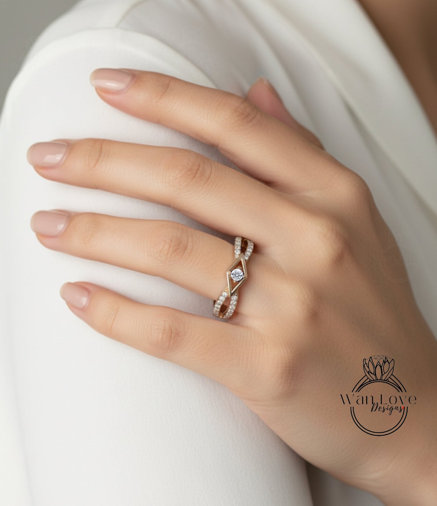A close-up of a person's hand wearing a gold ring with a diamond center stone.