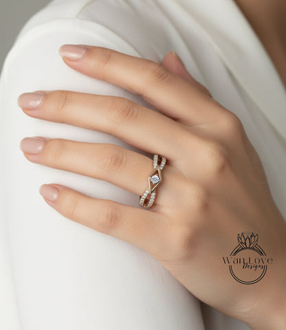 A close-up of a person's hand wearing a gold ring with a diamond center stone.
