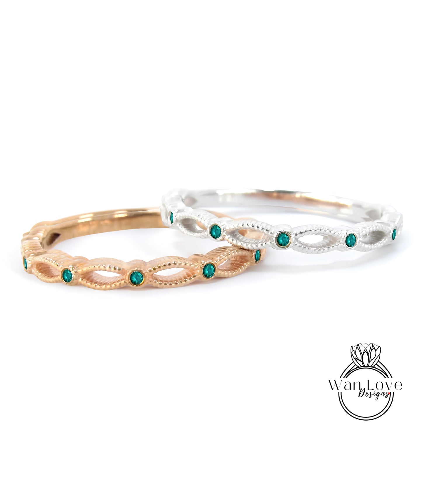 Two rings with green gemstones are displayed against a white background.