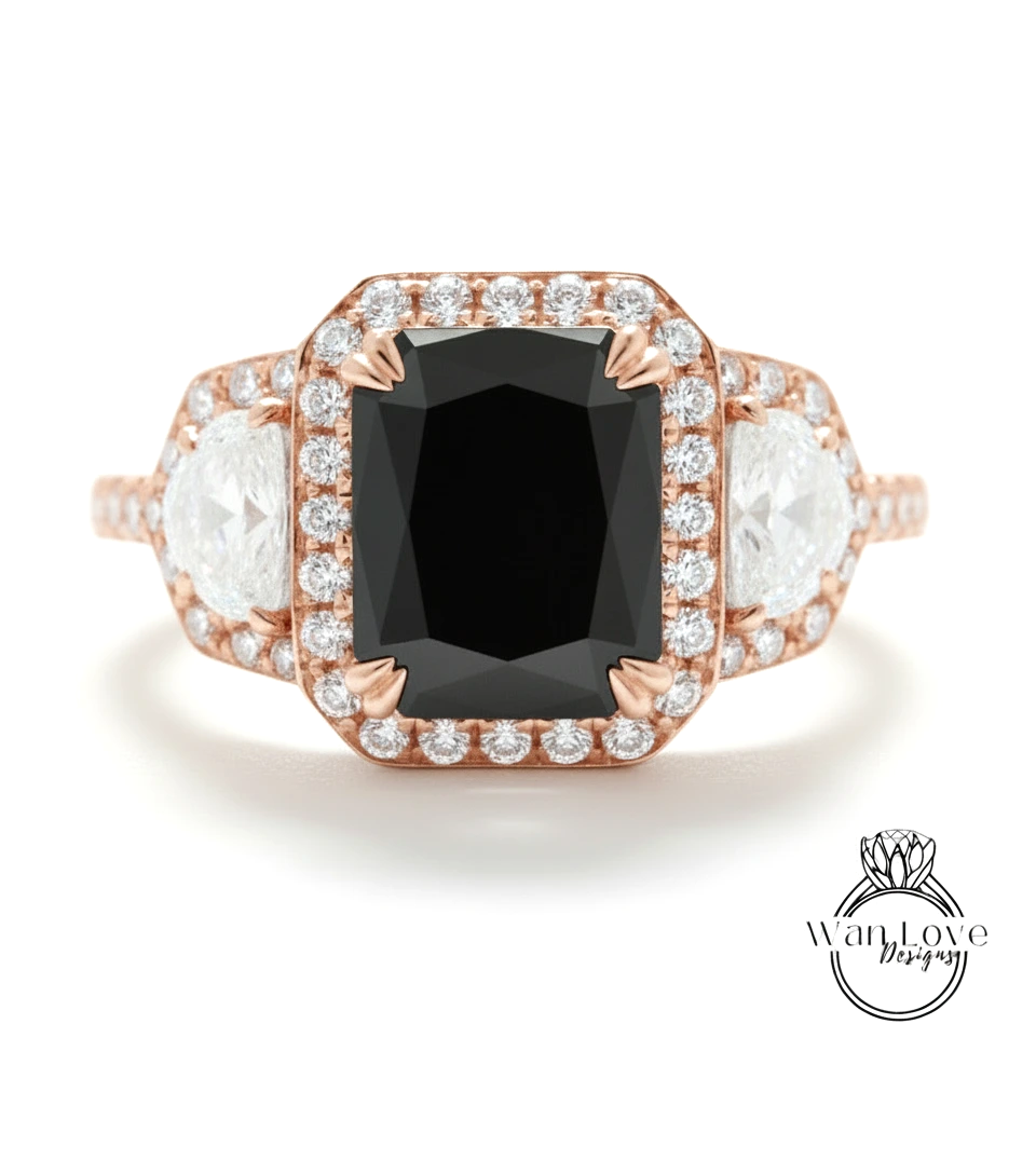 A rose gold ring with a large black diamond as the centerpiece, surrounded by smaller diamonds.