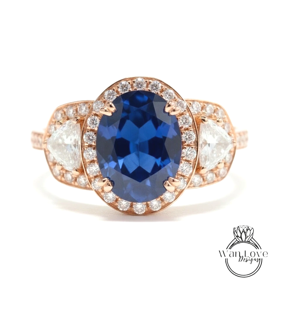 A close-up of a gold ring with a large blue gemstone at the center, surrounded by smaller diamonds.