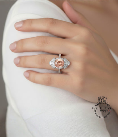 A close-up of a person's hand wearing a large, ornate ring with a large, round gemstone at the center.