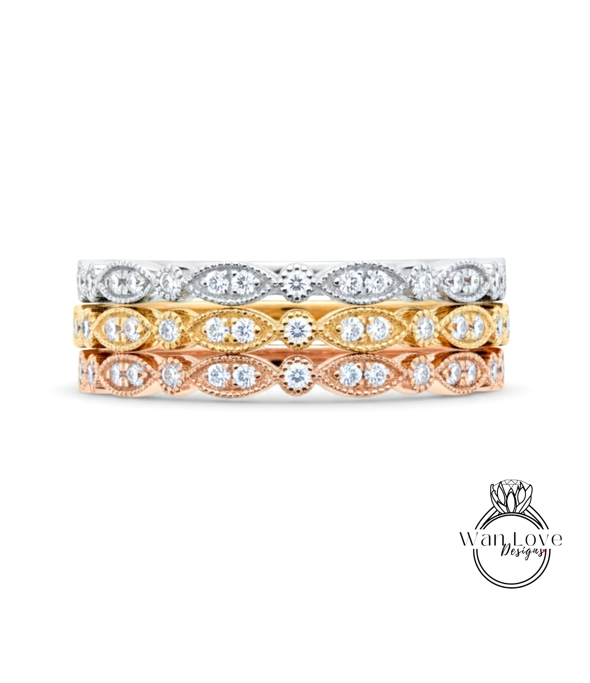 A stack of three rings with different colored gemstones set in the center.
