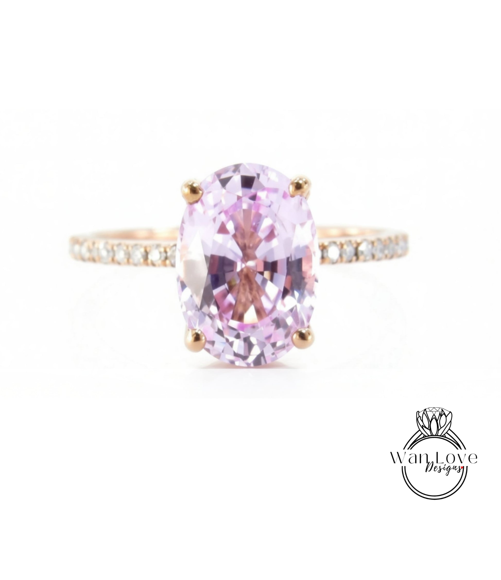 A pink gemstone engagement ring with a gold band and small diamonds.