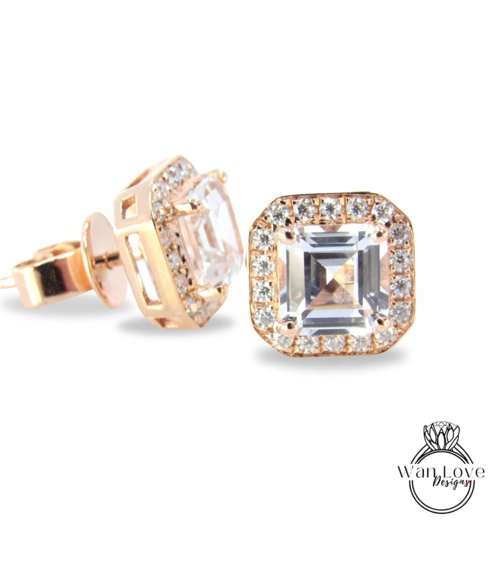 a pair of gold-toned earrings with a large, clear gemstone set in the center, surrounded by smaller diamonds.