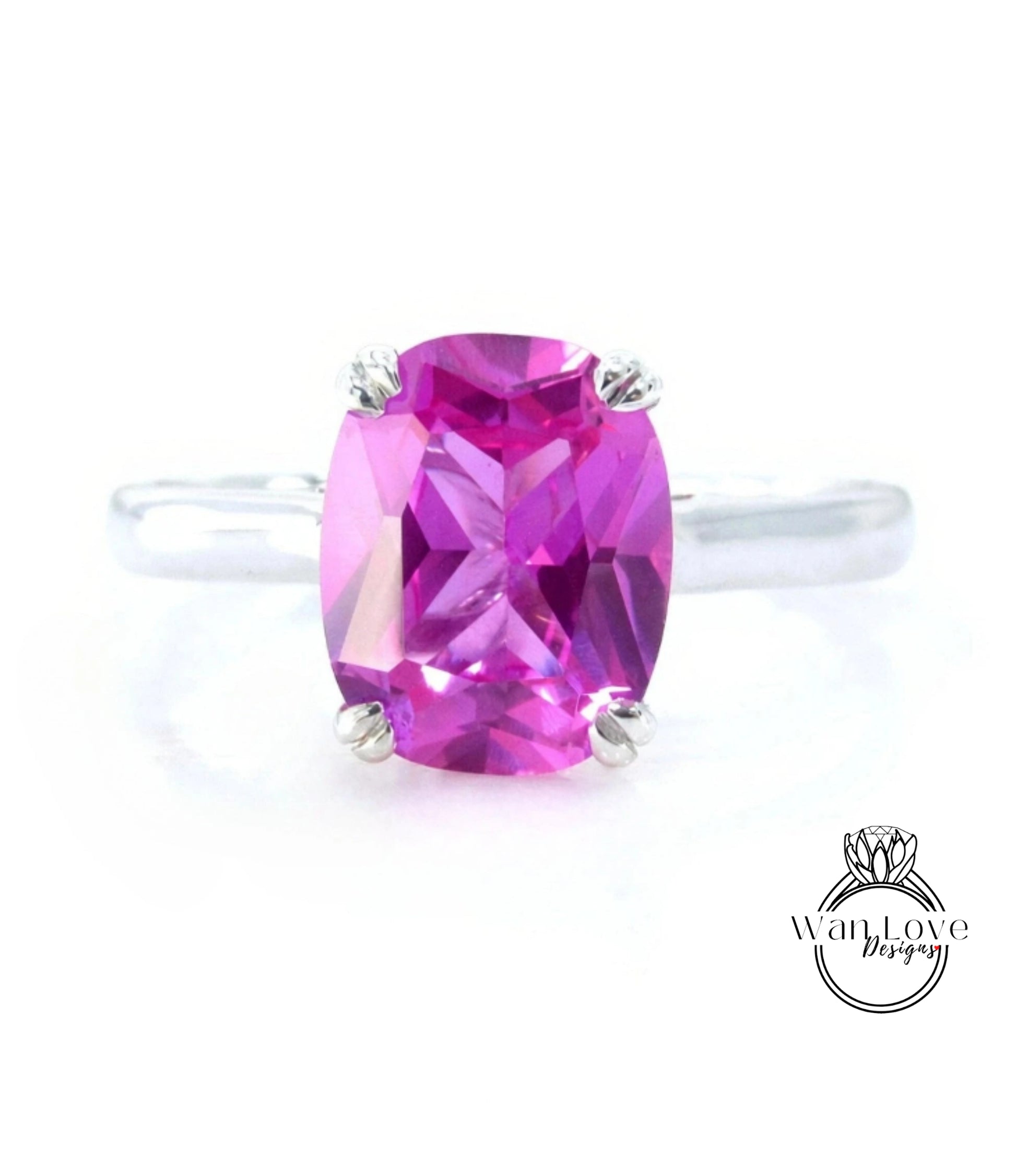 A ring with a large, oval-shaped, pink gemstone set in a silver band.