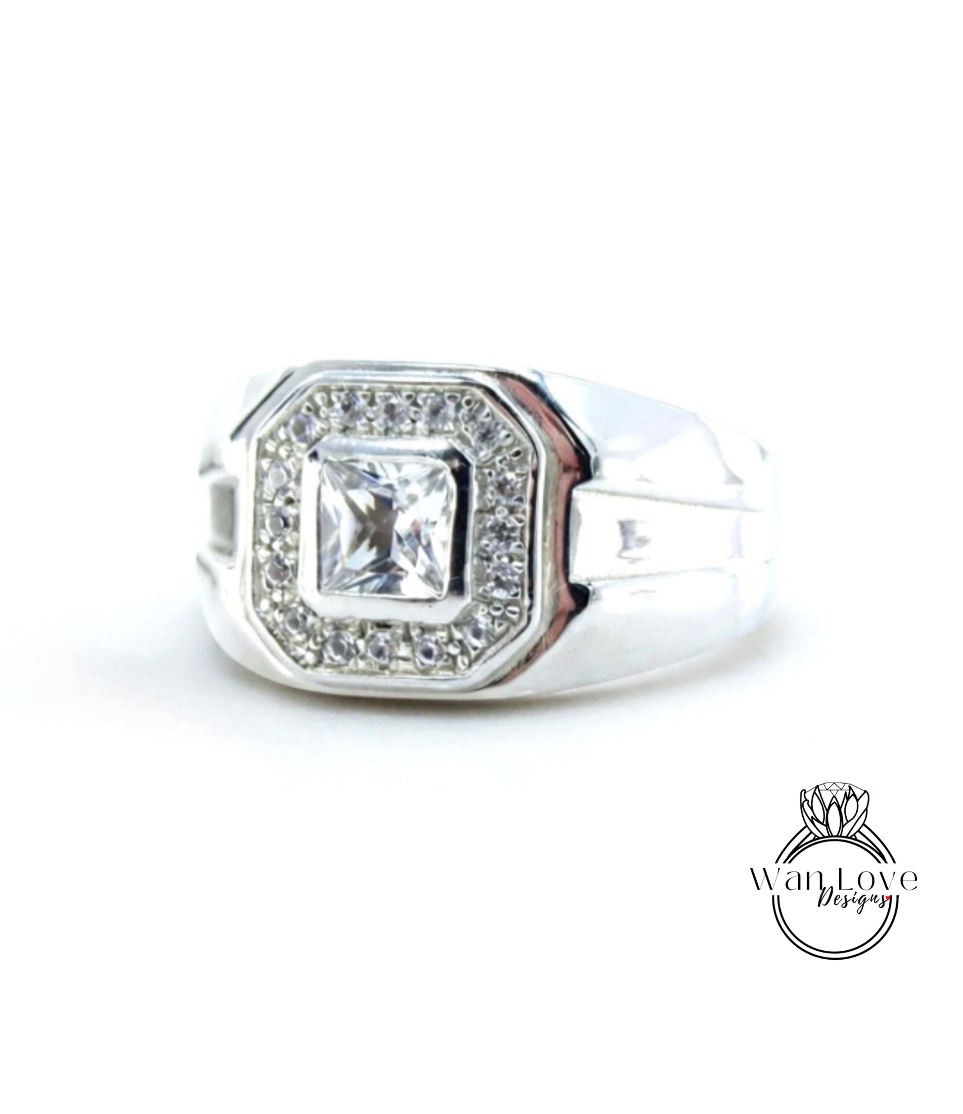 A silver ring with a large, clear gemstone set in the center.