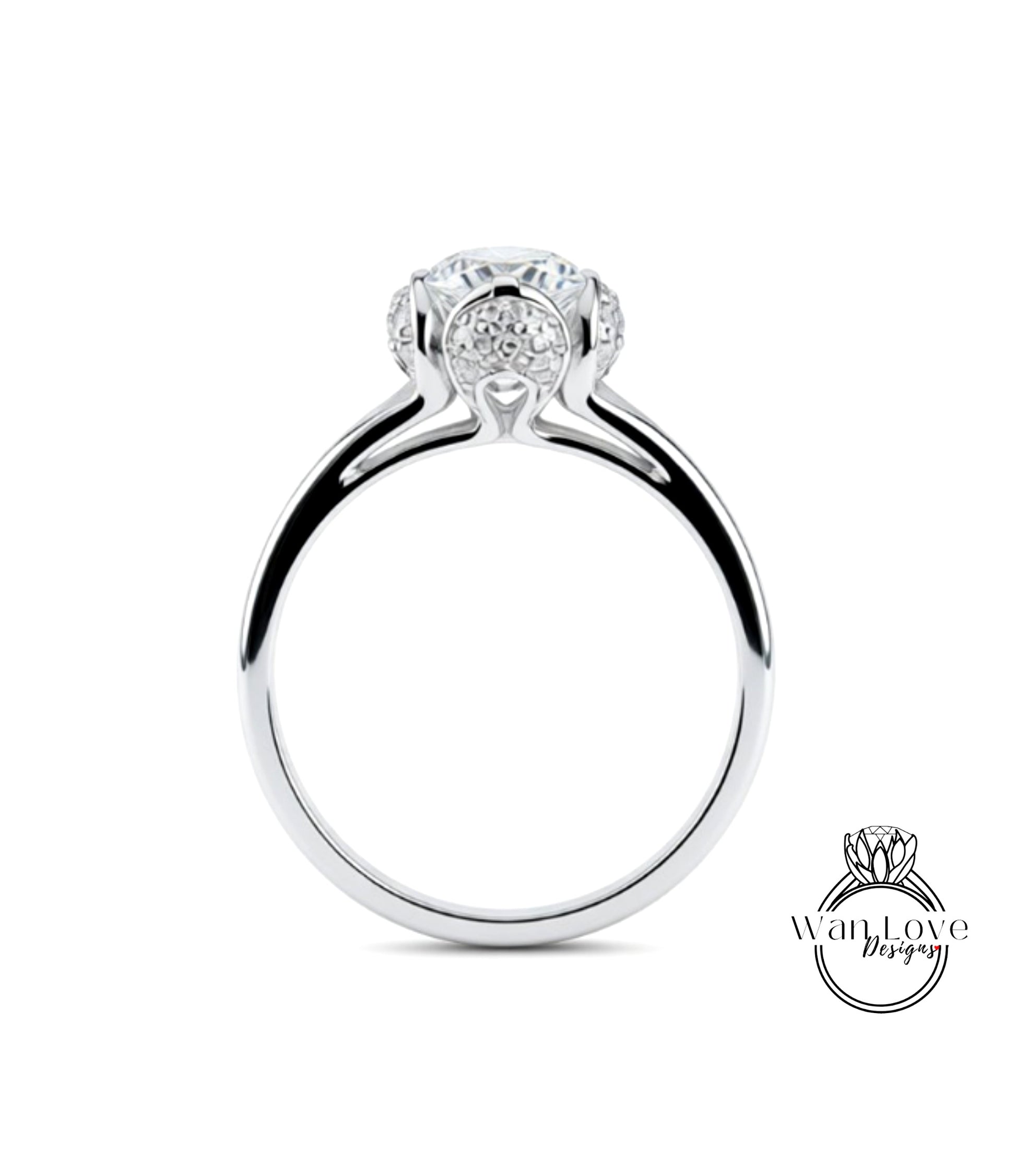 A silver engagement ring with a large central diamond surrounded by smaller diamonds.