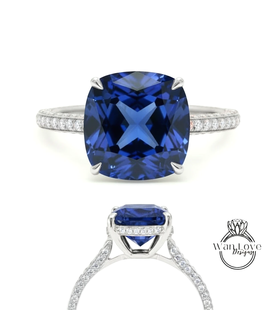 A stunning blue gemstone engagement ring with a large, square-cut sapphire set in a silver band adorned with small diamonds.