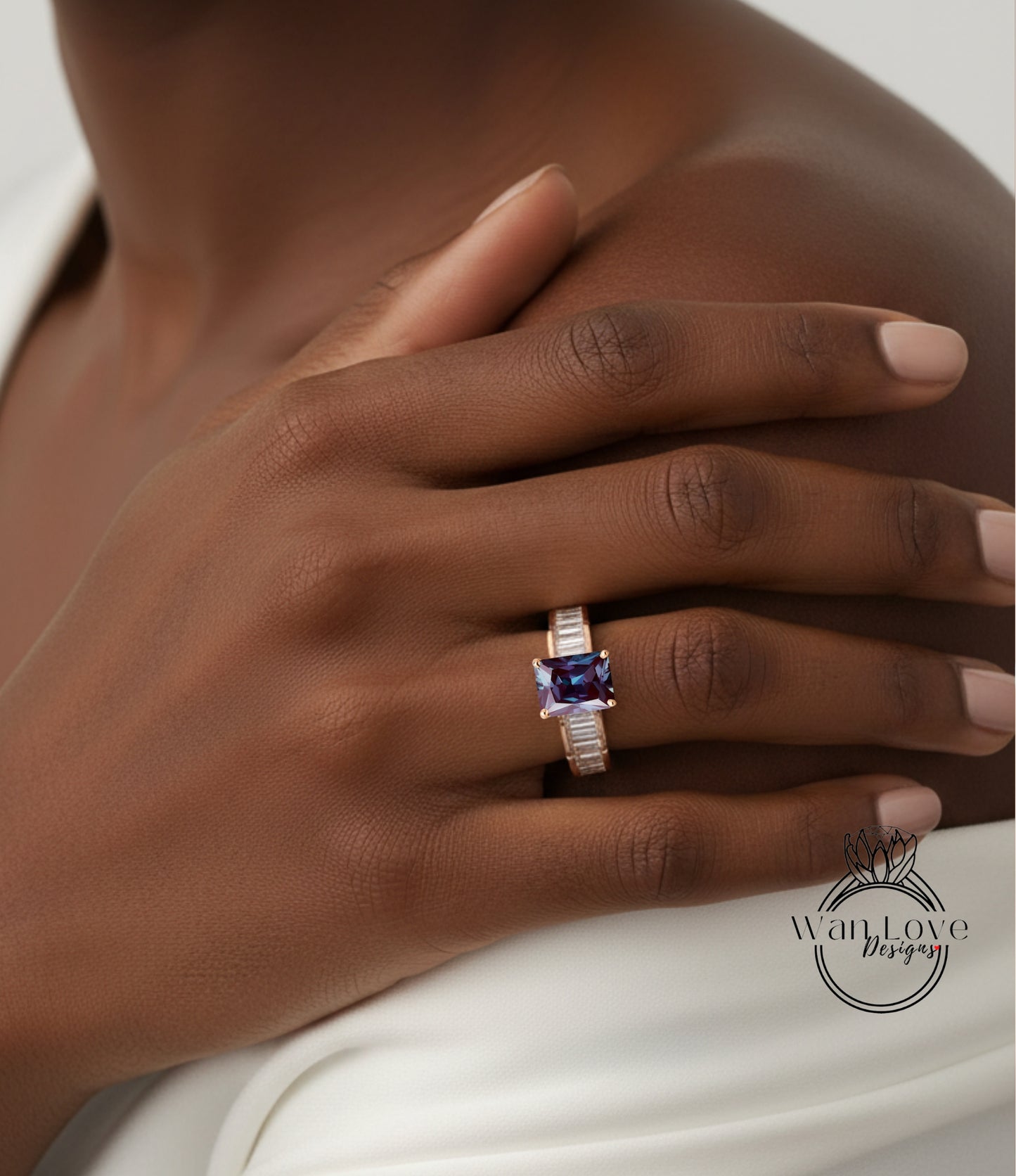 A close-up of a person's hand wearing a ring with a purple gemstone.