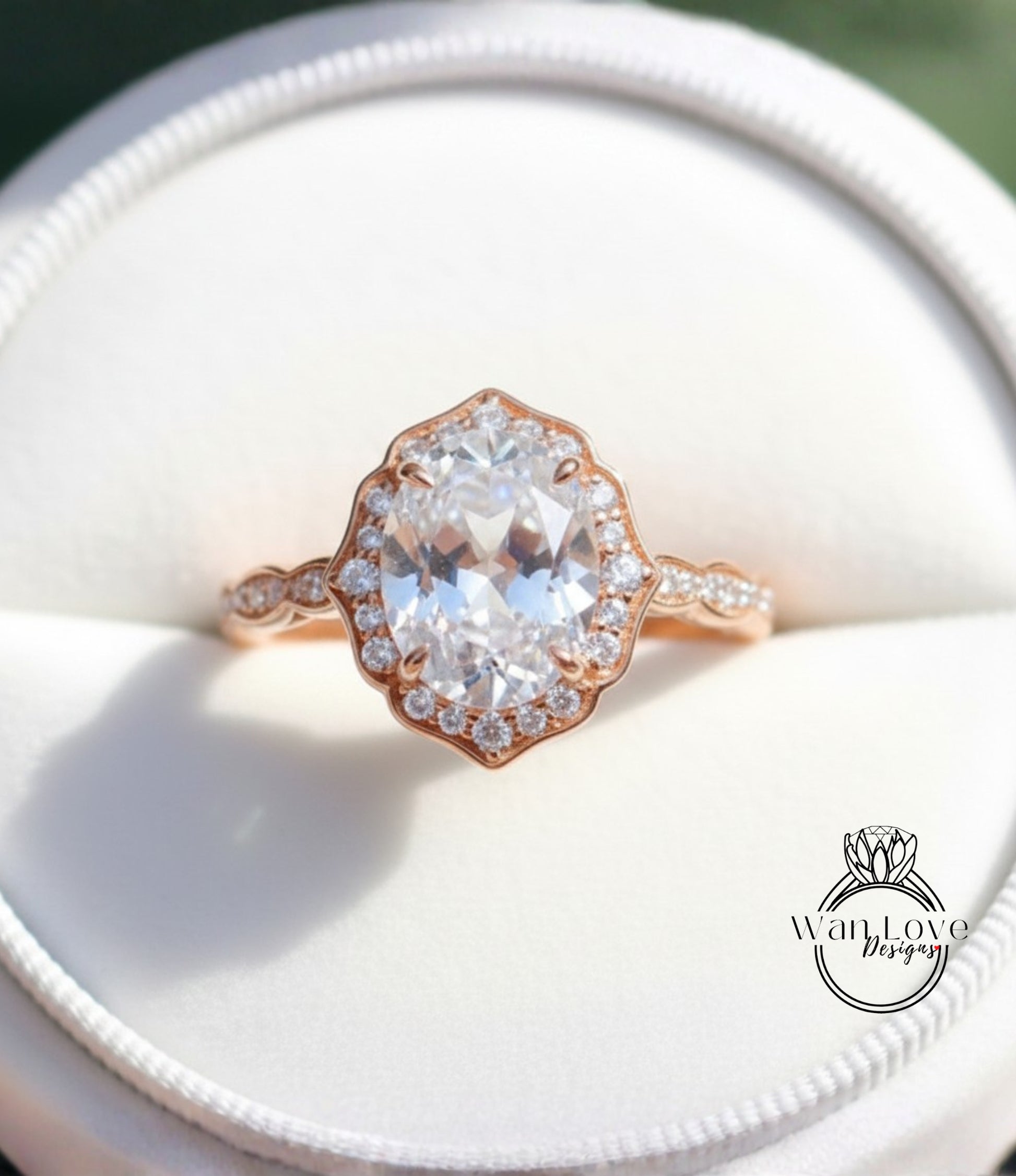 A close-up view of a beautiful diamond engagement ring, showcasing a large oval-shaped diamond surrounded by smaller diamonds set in a rose gold band.