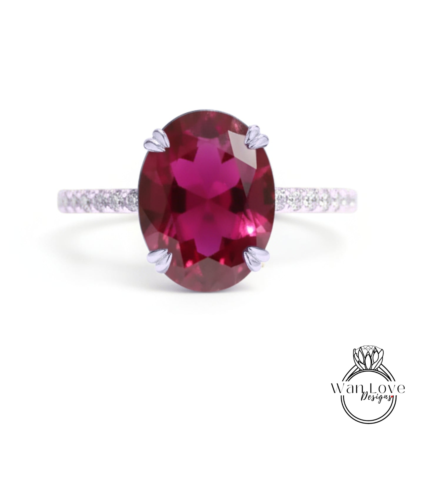 A large, oval-shaped, deep red gemstone, possibly a garnet, set in a silver ring with a thin band.