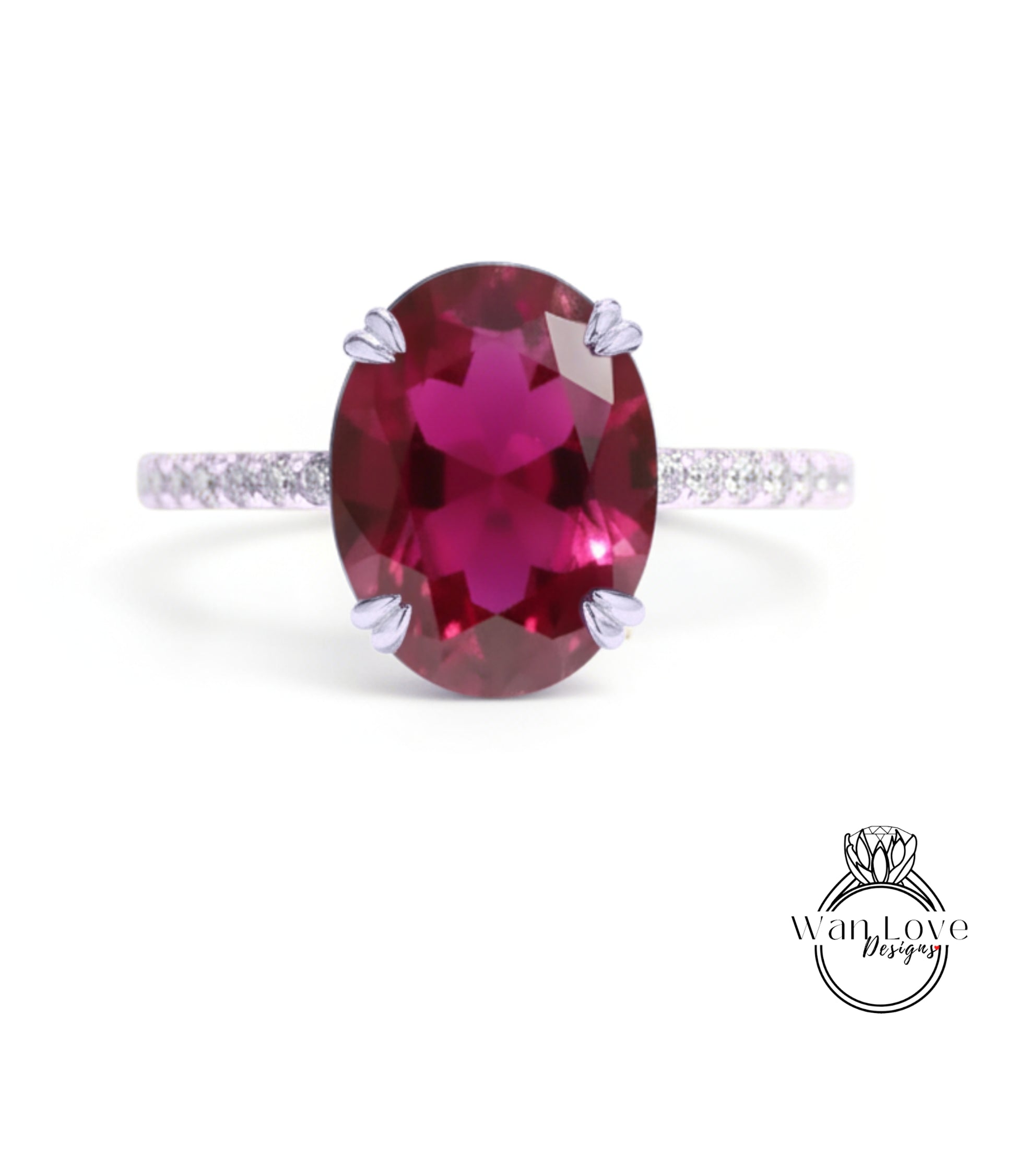 A large, oval-shaped, deep red gemstone, possibly a garnet, set in a silver ring with a thin band.