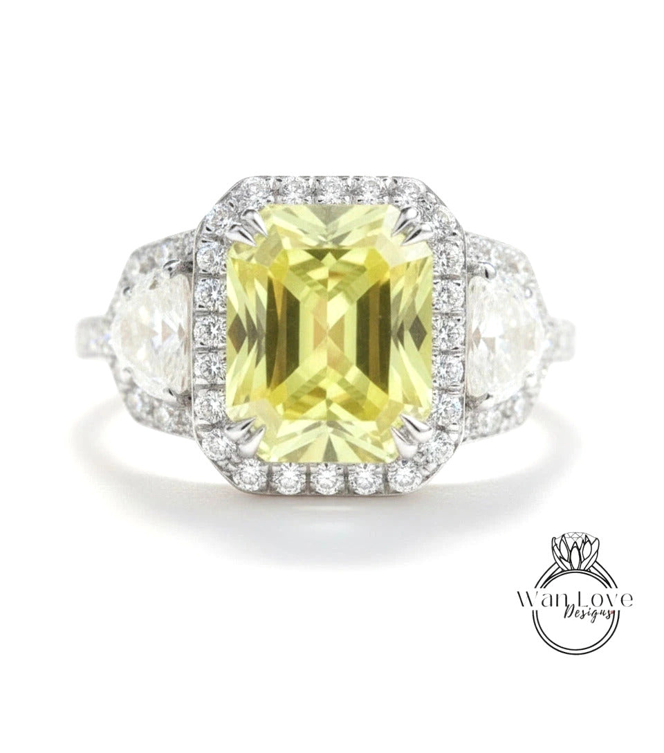 A stunning yellow gemstone ring with a halo of diamonds around it, set in a silver band.