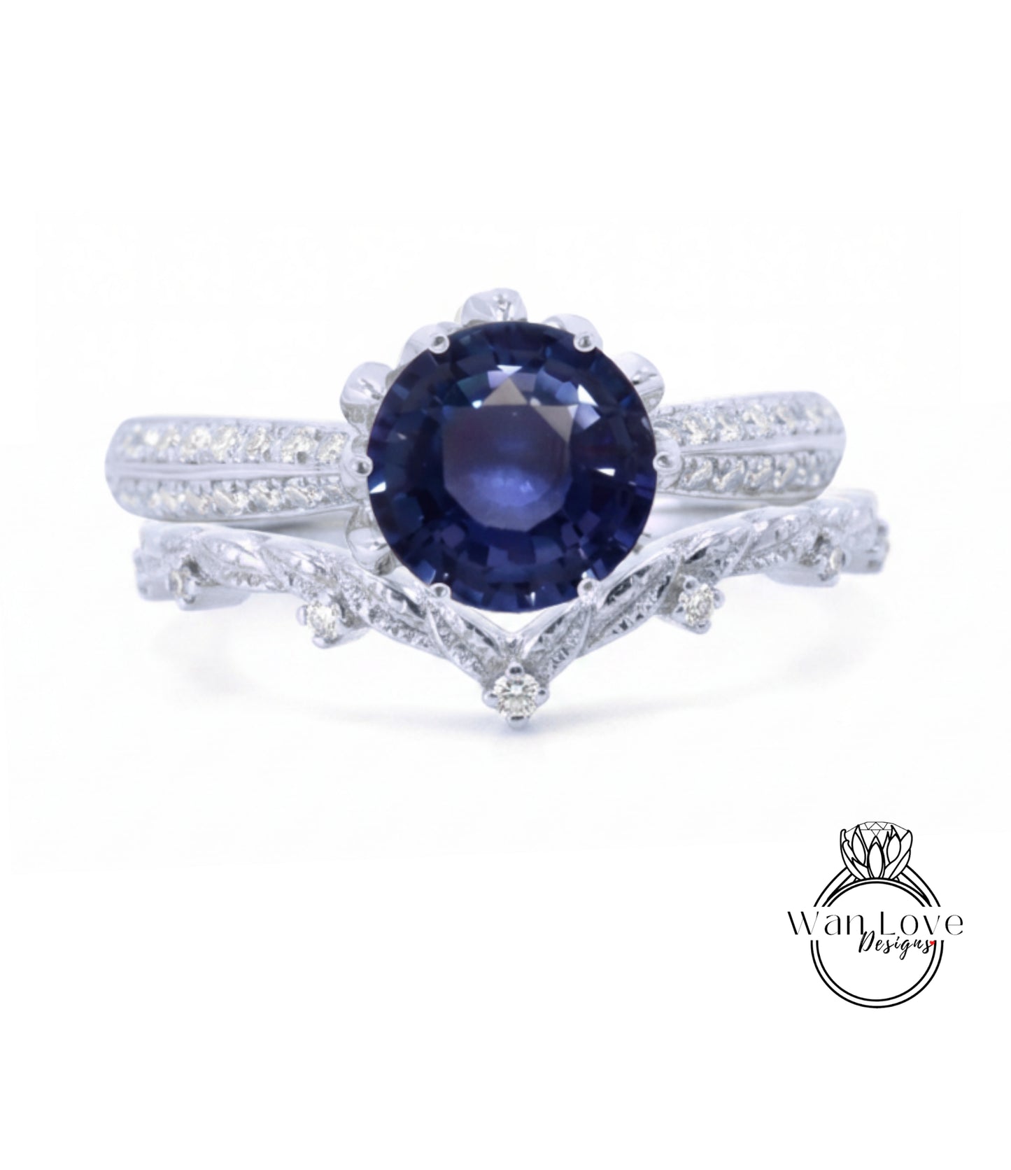 A close-up view of a silver ring with a large blue gemstone, possibly a sapphire, set in a decorative band.