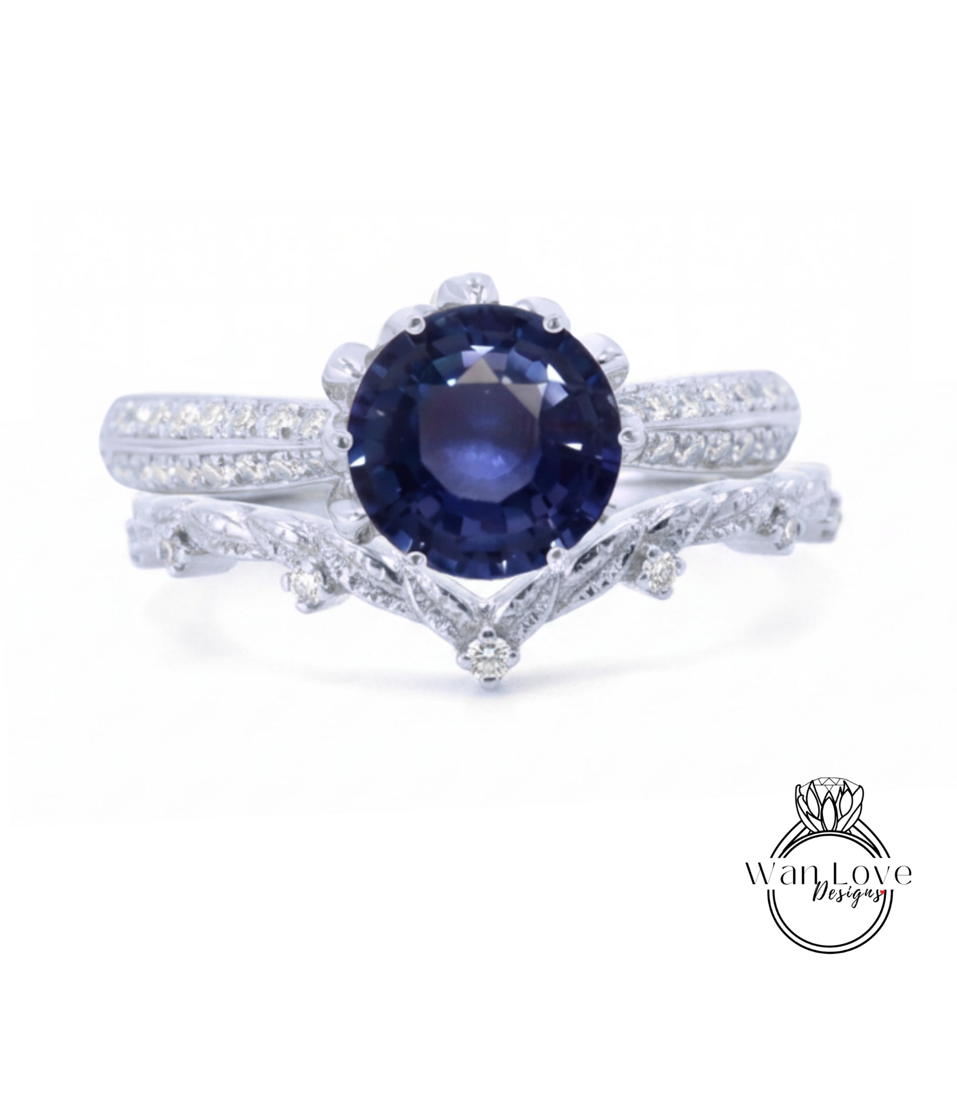A close-up view of a silver ring with a large blue gemstone, possibly a sapphire, set in a decorative band.