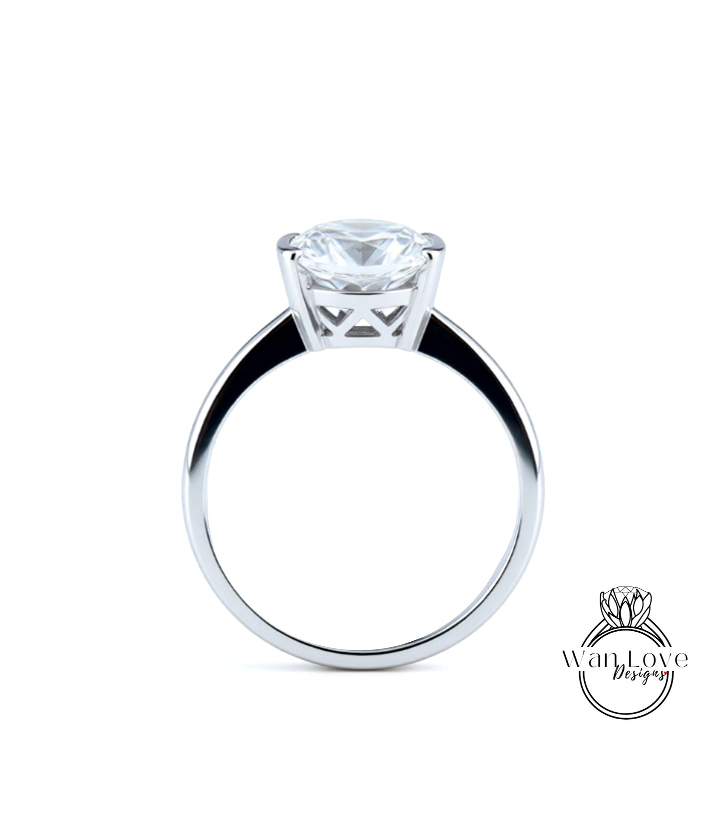A silver engagement ring with a large, clear diamond set in the center of the band.
