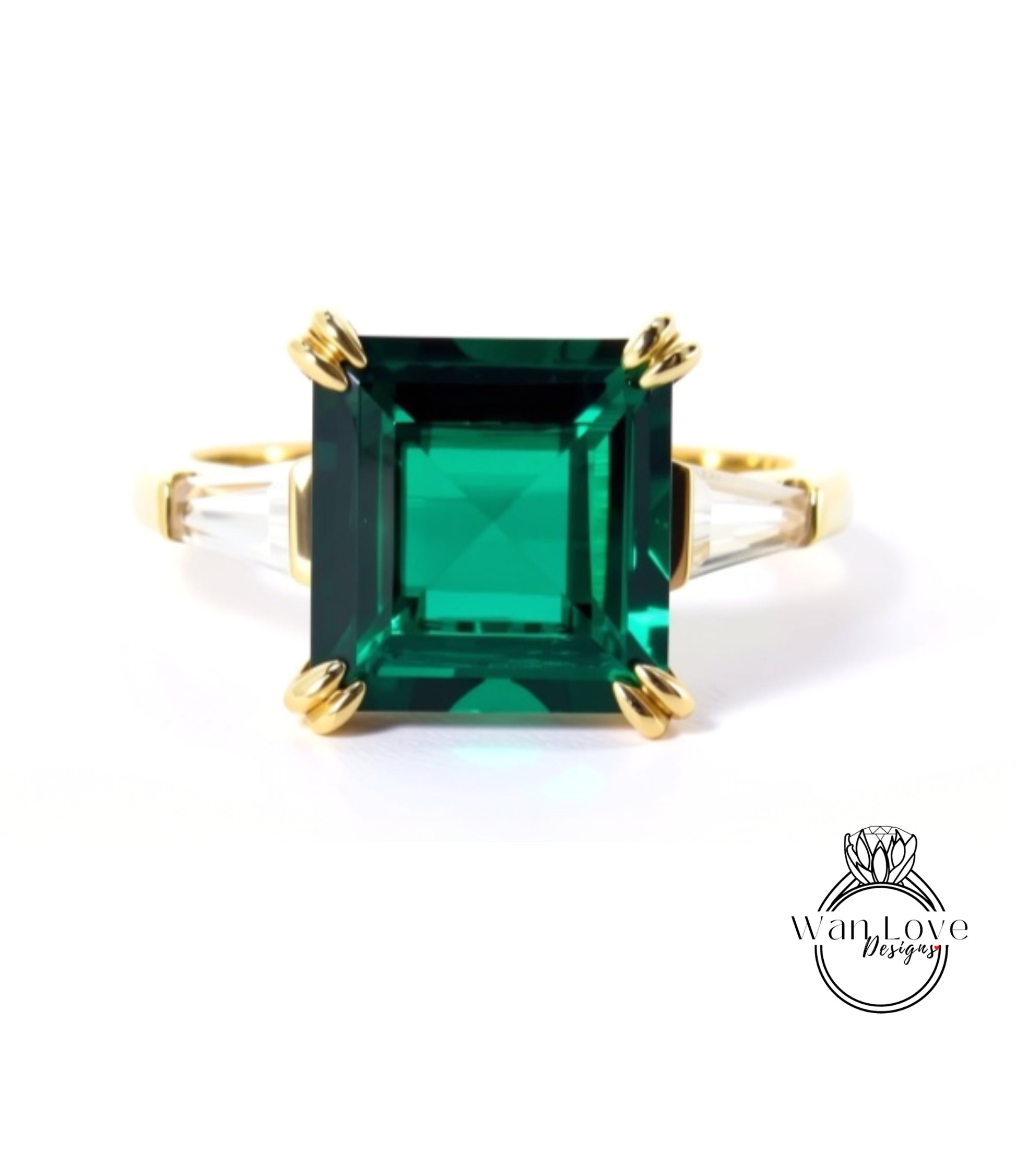 A large, square-cut green gemstone set in a gold ring.