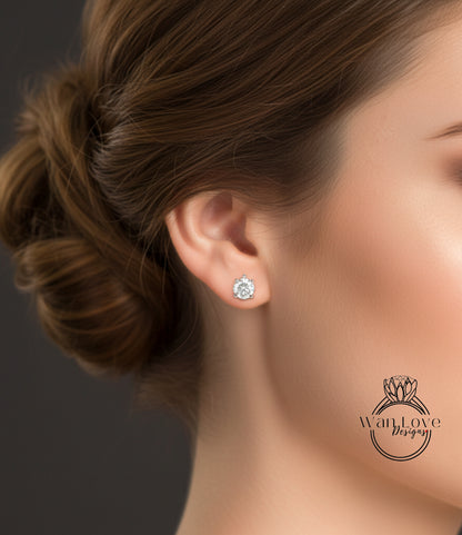 A close-up of a woman's ear with a diamond earring, showcasing the earring and the woman's hair.