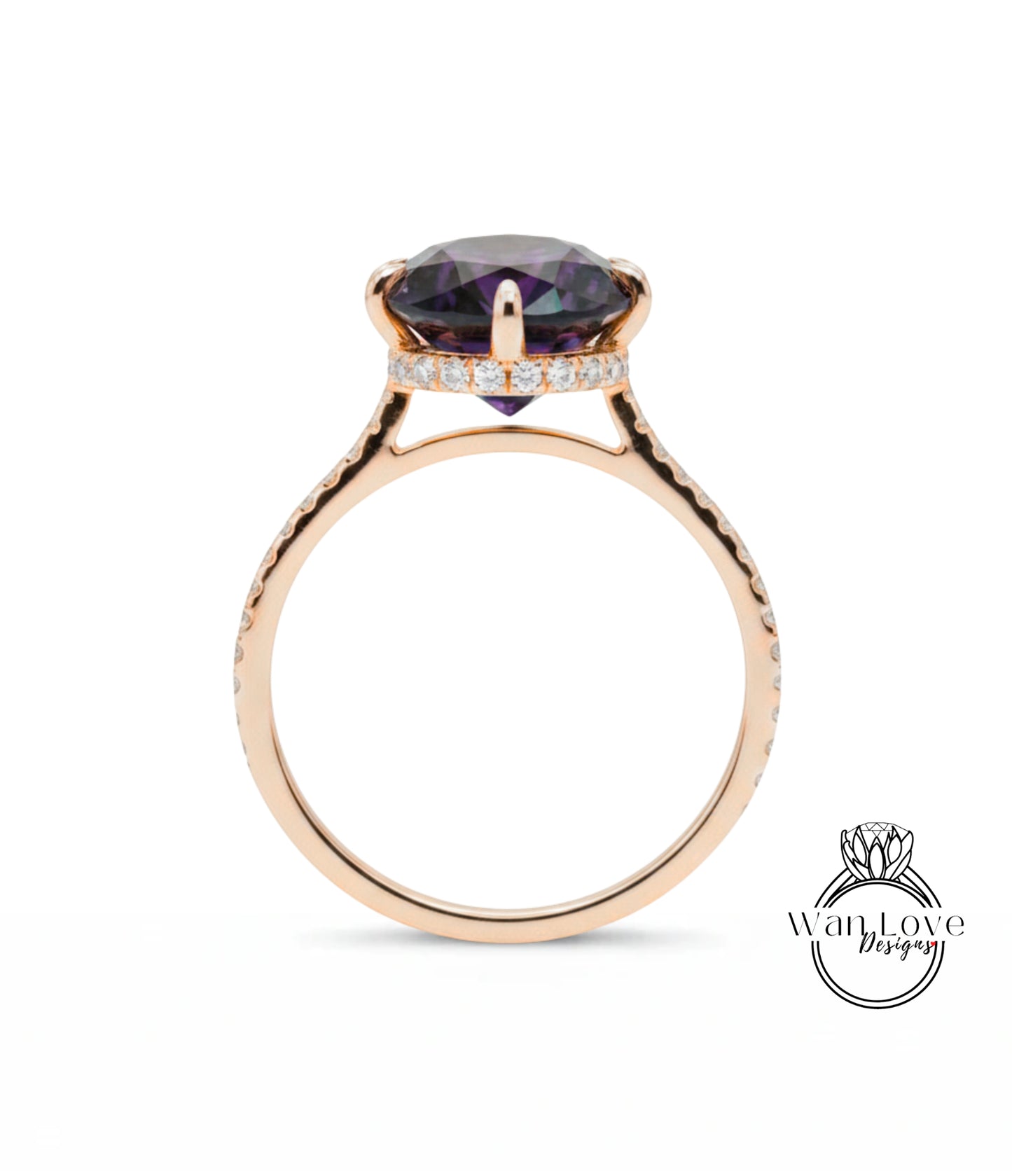 A gold ring with a large purple gemstone set in the center, surrounded by smaller diamonds.