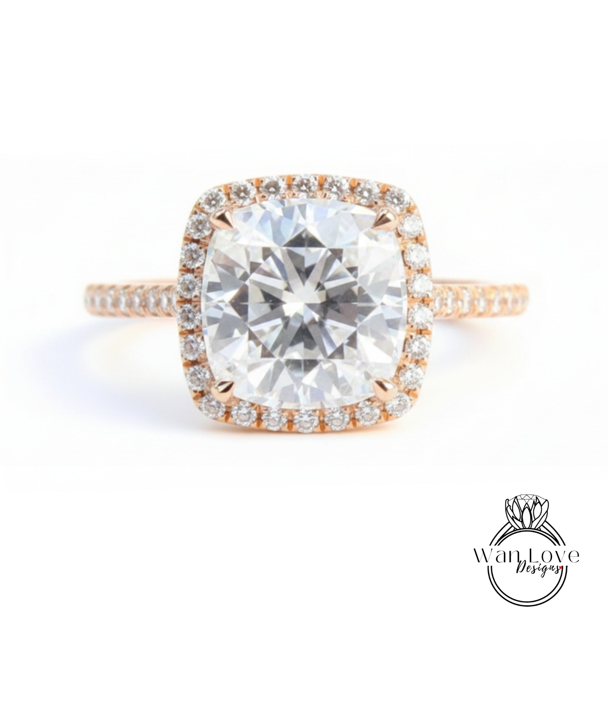 A large, round diamond engagement ring with a halo of smaller diamonds around the center stone.