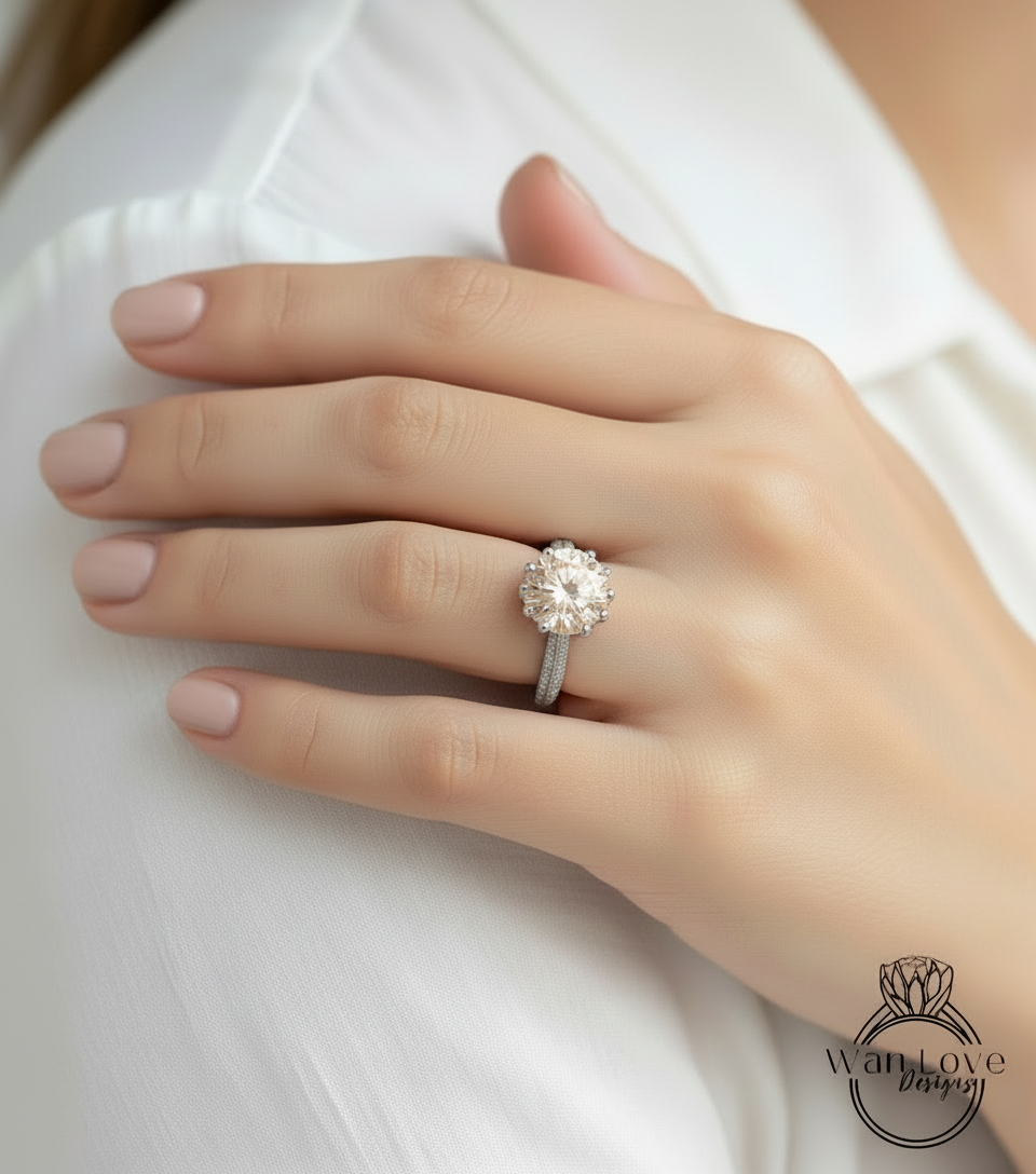 A close-up of a person's hand wearing a large, sparkling diamond engagement ring.