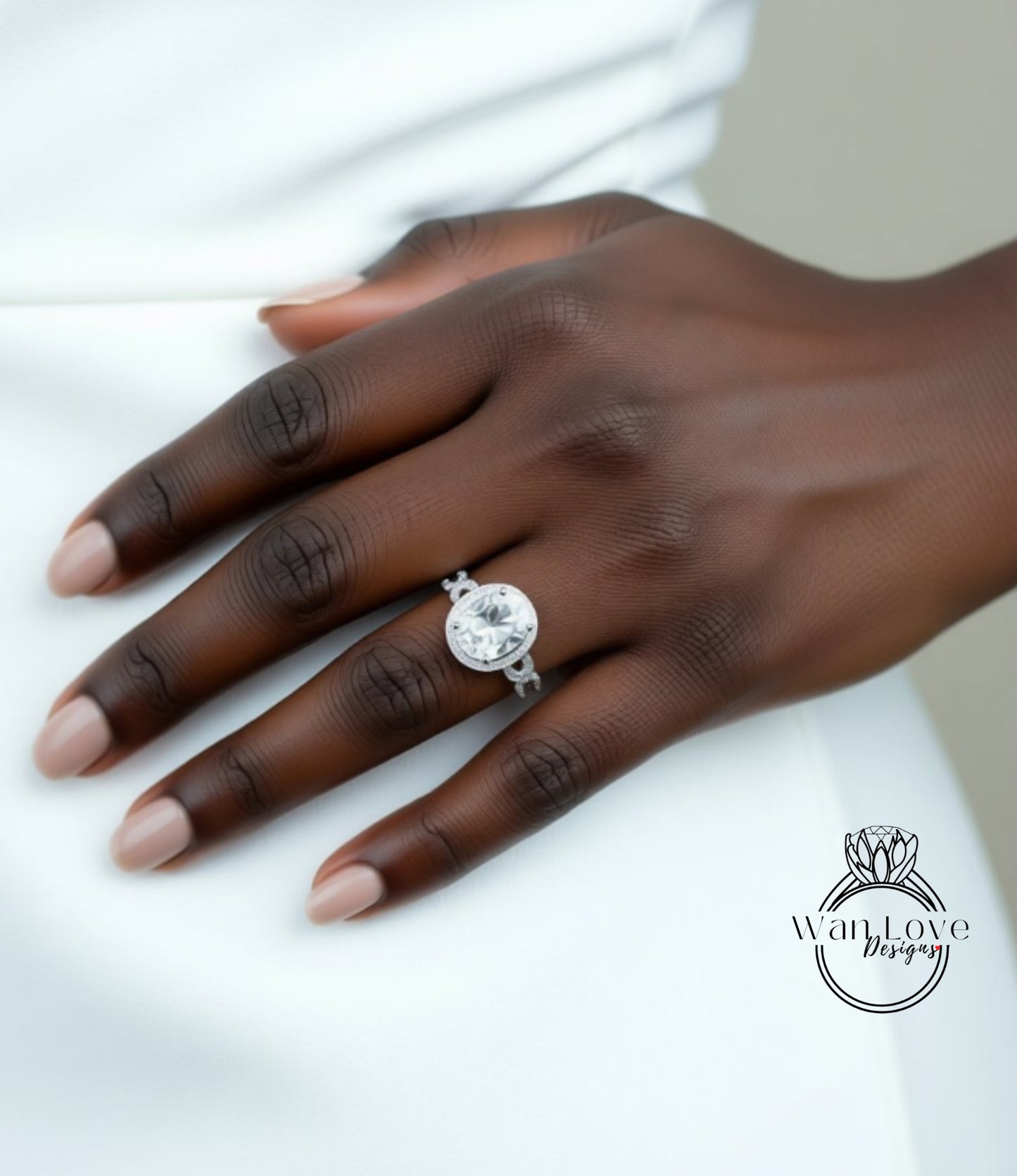 A close-up of a hand wearing a large diamond engagement ring.