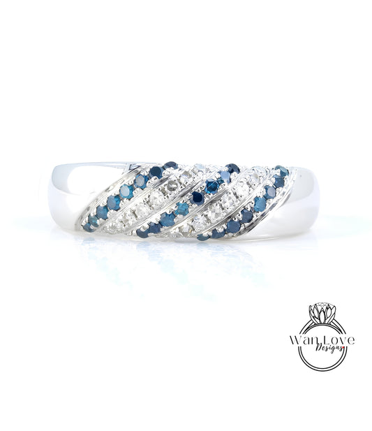 A silver ring adorned with blue and white gemstones, showcasing a unique and elegant design.