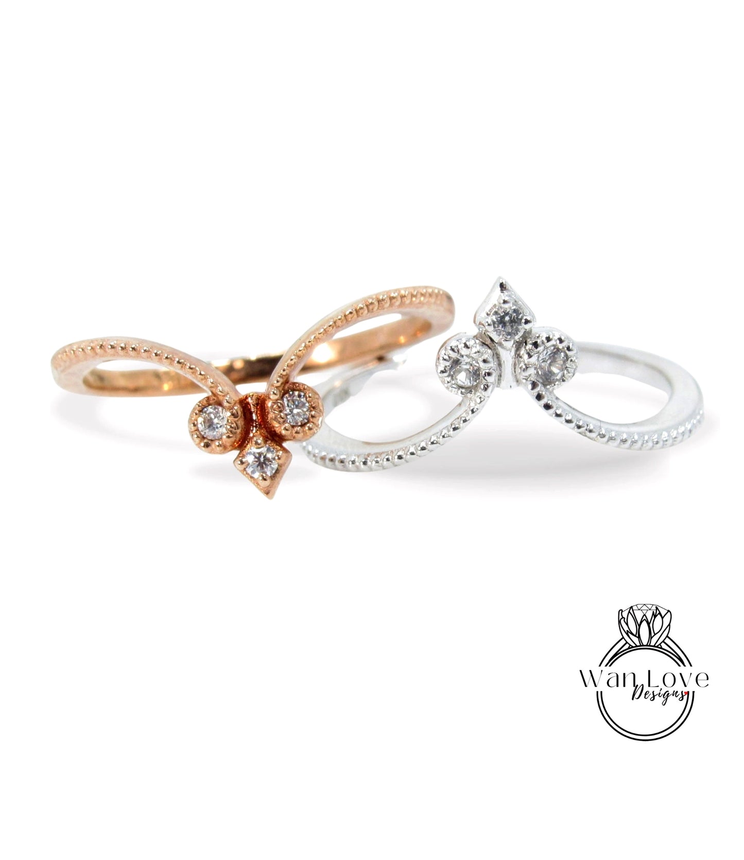 two rings with diamond accents, one in gold and the other in silver, set against a white background.